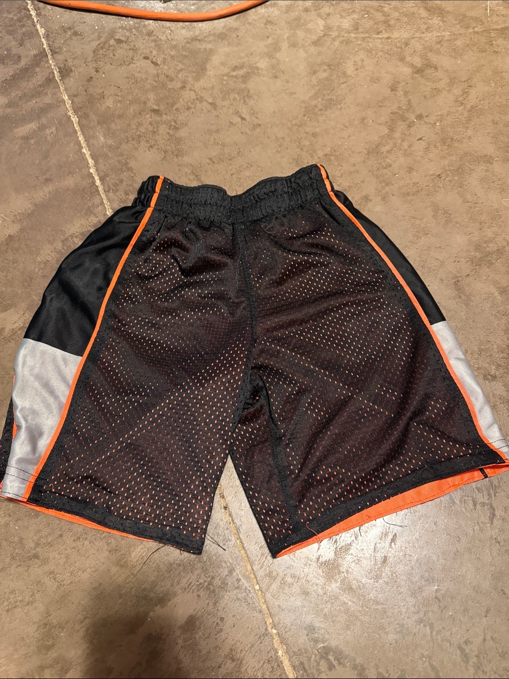 Kids Black Mesh Athletic Shorts with Orange Trim